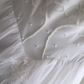 White fitted long ball gown with beaded details exudes elegance R6690