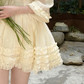 Light apricot V-neck, waist-cinching, tiered ruffle short ball gown R7996