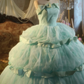 Light green strapless ball gown with a cinched waist and a voluminous puffy skirt; bridal gown R7283
