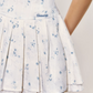White Floral Corset Mini Dress with Ruffled Trim Neckline, Puff Cap Sleeves, Pleated Skirt and Smocked Back R9252