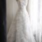 White strapless embroidered A-line ball gown with a fitted waist and full skirt R6771