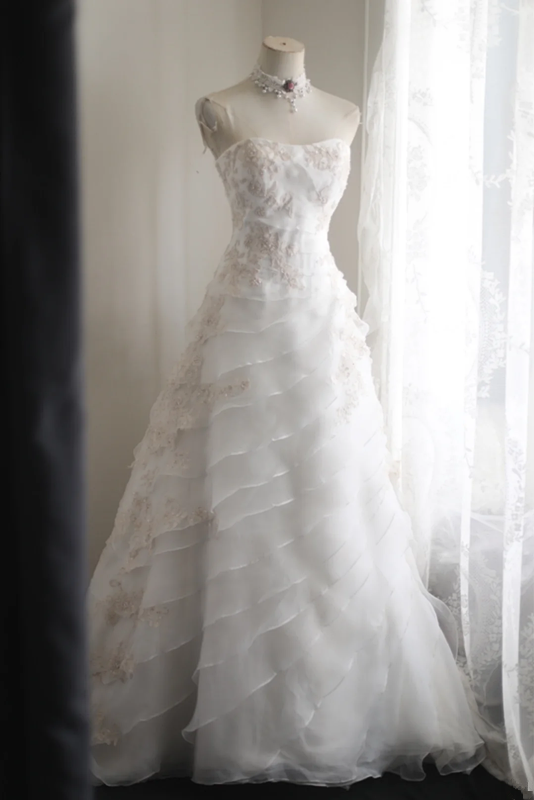 White strapless embroidered A-line ball gown with a fitted waist and full skirt R6771