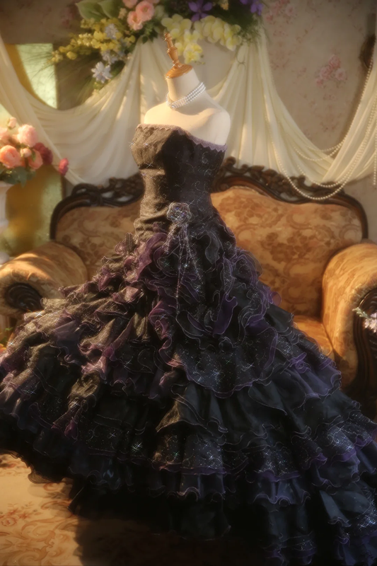 Black strapless ball gown with a cinched waist and a tiered cake skirt; bridal gown R7284