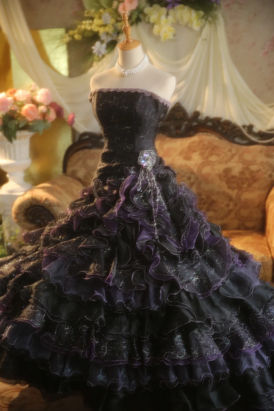 Black strapless ball gown with a cinched waist and a tiered cake skirt; bridal gown R7284