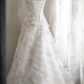 White strapless embroidered A-line ball gown with a fitted waist and full skirt R6771