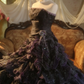 Black strapless ball gown with a cinched waist and a tiered cake skirt; bridal gown R7284