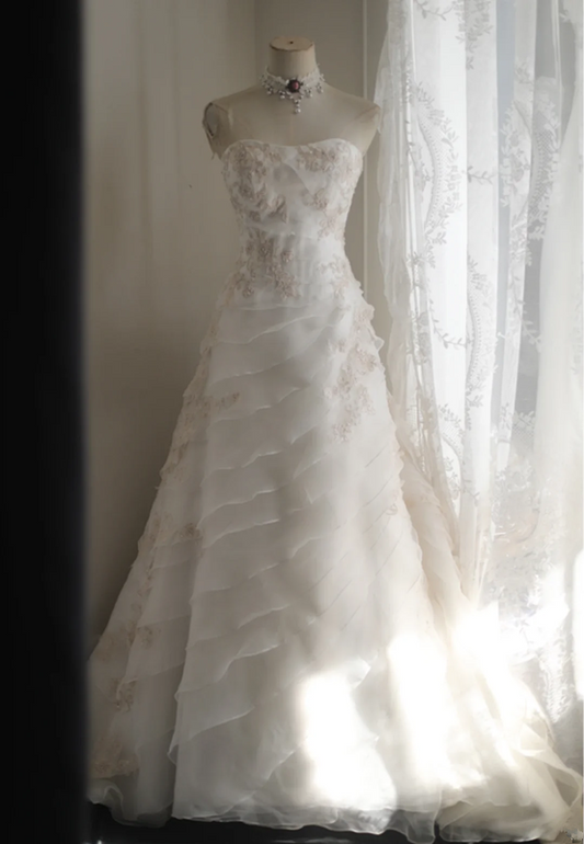 White strapless embroidered A-line ball gown with a fitted waist and full skirt R6771