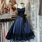 Navy blue halter-neck fitted waist ball gown with a full skirt R7492