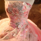 Pink floral-patterned strapless ball gown with a cinched waist and a voluminous puffy skirt; bridal gown R7285