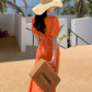 Orange V-neck French puff sleeve dress Hot girl hollow waist design high-end seaside holiday dress R0202
