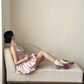 Champagne pink spaghetti strap, waist‑cinching, short ball gown with a fluffy, ruffled bud‑style skirt R7999