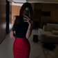 Slim-fitting black sleeveless top and red hip-hugging skirt are a complete set R0726