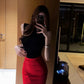 Slim-fitting black sleeveless top and red hip-hugging skirt are a complete set R0726