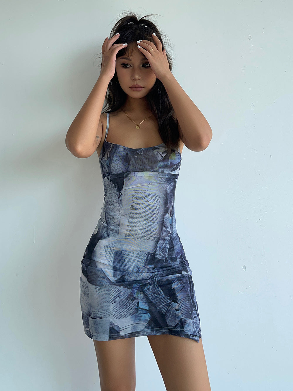 Newspaper mesh suspender short skirt hot girl hip-hugging figure dress European and American style R3041