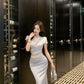 A blue V-neck short-sleeved top and skirt with a sense of luxury R0841