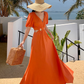 Orange V-neck French puff sleeve dress Hot girl hollow waist design high-end seaside holiday dress R0202